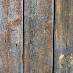 wooden background with weathered wood and ruusty nails