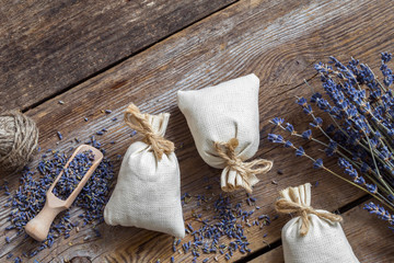 Bunch of lavender flowers and sachets filled with dried lavender