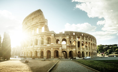 Fototapeta na wymiar Colosseum in Rome and morning sun, Italy
