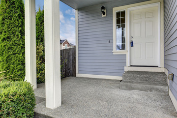 Entrance porch with concrete floor and columns