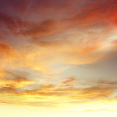 Naklejka na ściany i meble Warm summer sunrise orange clouds sunset sky background