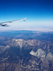Fototapeta na wymiar Flying over mountains