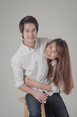 happy young couple shooting in studio