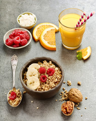 bowl of muesli with fresh berries and banana