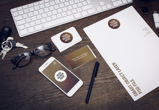 Smartphone and Stationery on Wooden Desk Mockup 2