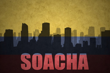 Fototapeta premium abstract silhouette of the city with text Soacha at the vintage colombian flag