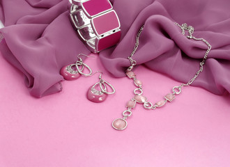 Fashion jewelry advertisement - pink bijouterie on velvet background