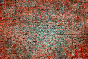 Cracked and peeling paint on the wall. Close-up view. Grunge old texture. Abstract background. Vintage style. Scratched and chipped surface.