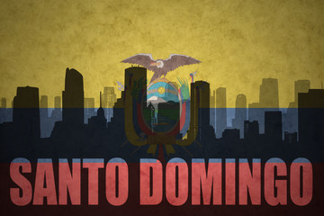 abstract silhouette of the city with text Santo Domingo at the vintage ecuadorian flag