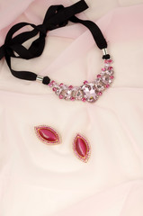 Fashion jewelry advertisement - bijouterie on pink kerchief