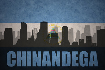 abstract silhouette of the city with text Chinandega at the vintage nicaraguan flag