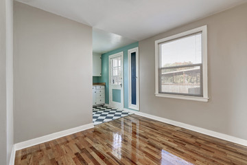 Empty beige room with hardwood floor in old empty house