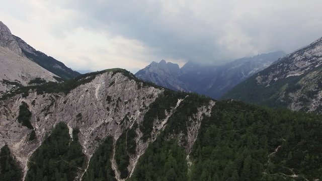 AERIAL VIEW: flight around Kranjska Gora. Triglav National Park. Vrsic mountain pass. camera moving forwards