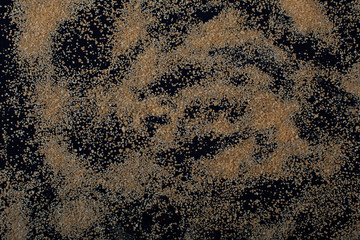 Brown sugar on black background