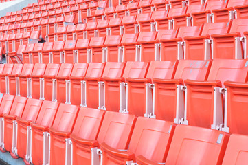 Empty orange seats at stadium,Rows of seat on a soccer stadium