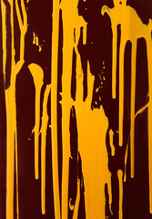 Yellow paint on a dark background