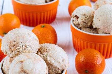 Homemade Ice cream with a citrus on a white wooden background