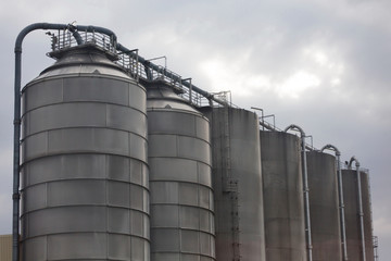 Industrial site of the chemical industry. Concrete factory or cement heavy industry manufacturing.