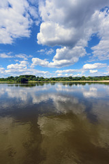 Amazing clouds over Vistula river in sunny day. Poland, Europe.