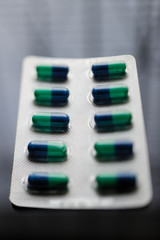 Medicament pill capsules on glass table prescription from doctor