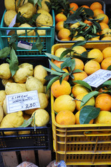 Fresh lemons, oranges and other fruits and vegetables on a street market in Sorrento, Amalfi Coast...