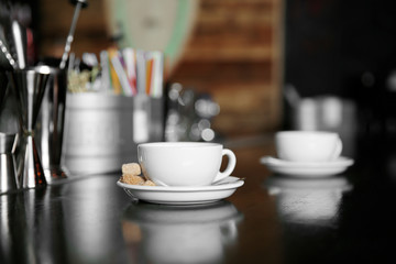 Cup of coffee on bar counter