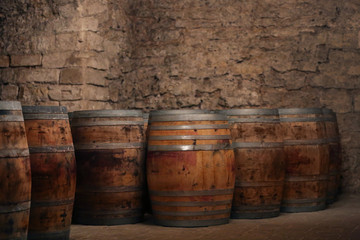 Fototapeta premium Wine barrels in winery cellar
