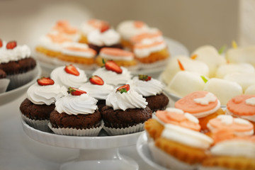 Wedding cupcakes on white stand