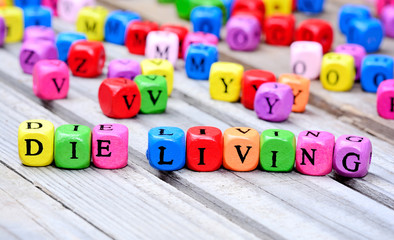 Die living words on table