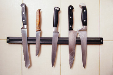 Picture of many knives represented on kitchen. Knives with steel blades for cooking or preparing any dishes or meals.