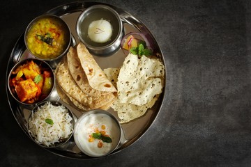 Indian vegetarian Thali isolated on white, top down view