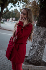 portrait of beautiful girl with blue eyes in red