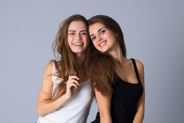 Two young women embracing