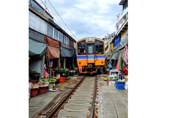 Foto op Aluminium Rom Hub Market (Maeklong Railway Market). attractions of Samut Songkhram province with identity. To close the umbrella in the train went into and out of the station. © chiradech