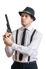 Young mafia man or detective holds gun in hands. Isolated on white background.