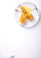 Natural honey comb on the plate.selective focus.Top view.