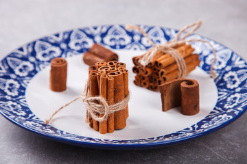 Cinnamon sticks on plates.. selective focus.