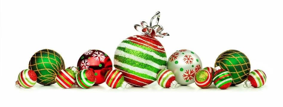 Christmas border of red, green and white ornaments isolated on a white background