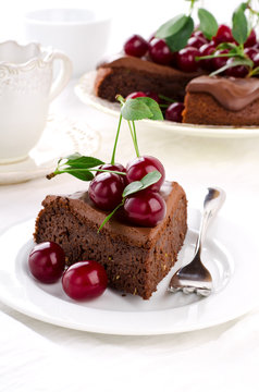 Chocolate cake with cherries and ganache cream.