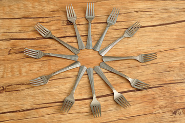 Cake forks isolated on a wooden background