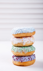 Donuts in colored glazes on a white background.Pastries,dessert.selective focus.