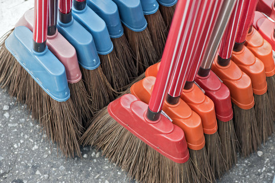 Brooms for sale at street market stall in Brazil