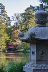 Japanese gardens.  public parks.  red bridge over water.  