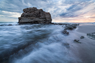 Big rock beach sunset long exposure