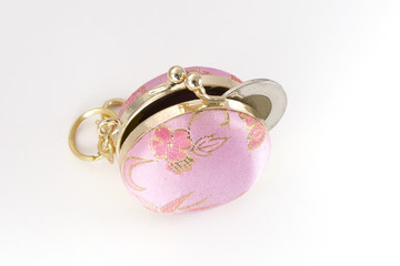 Open change purse with coin stiking protruding
