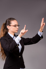 Young woman businesswoman pressing virtual buttons