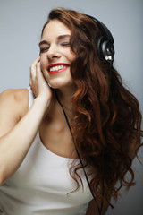 Young   woman with headphones listening music 