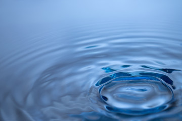 Abstract circle ripple water drop reflection. Blue fresh liquid