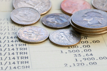 Coin stack on account book bank