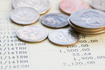 Coin stack on account book bank